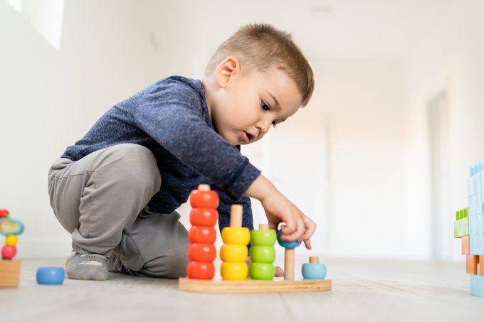 preschool child working with blocks