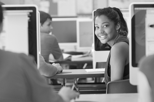 Smiling student in a computer lab