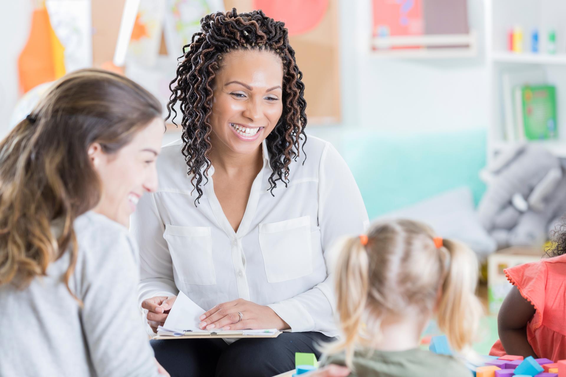 A parent and child meet with the classroom teacher.