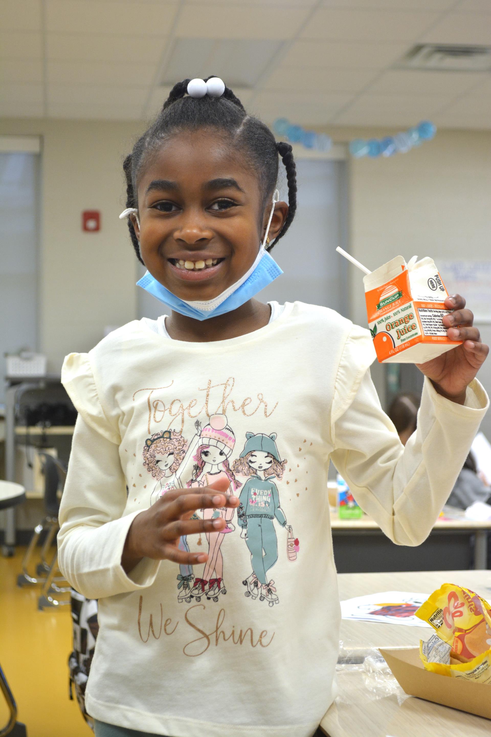 Student eating breakfast in the classroom.