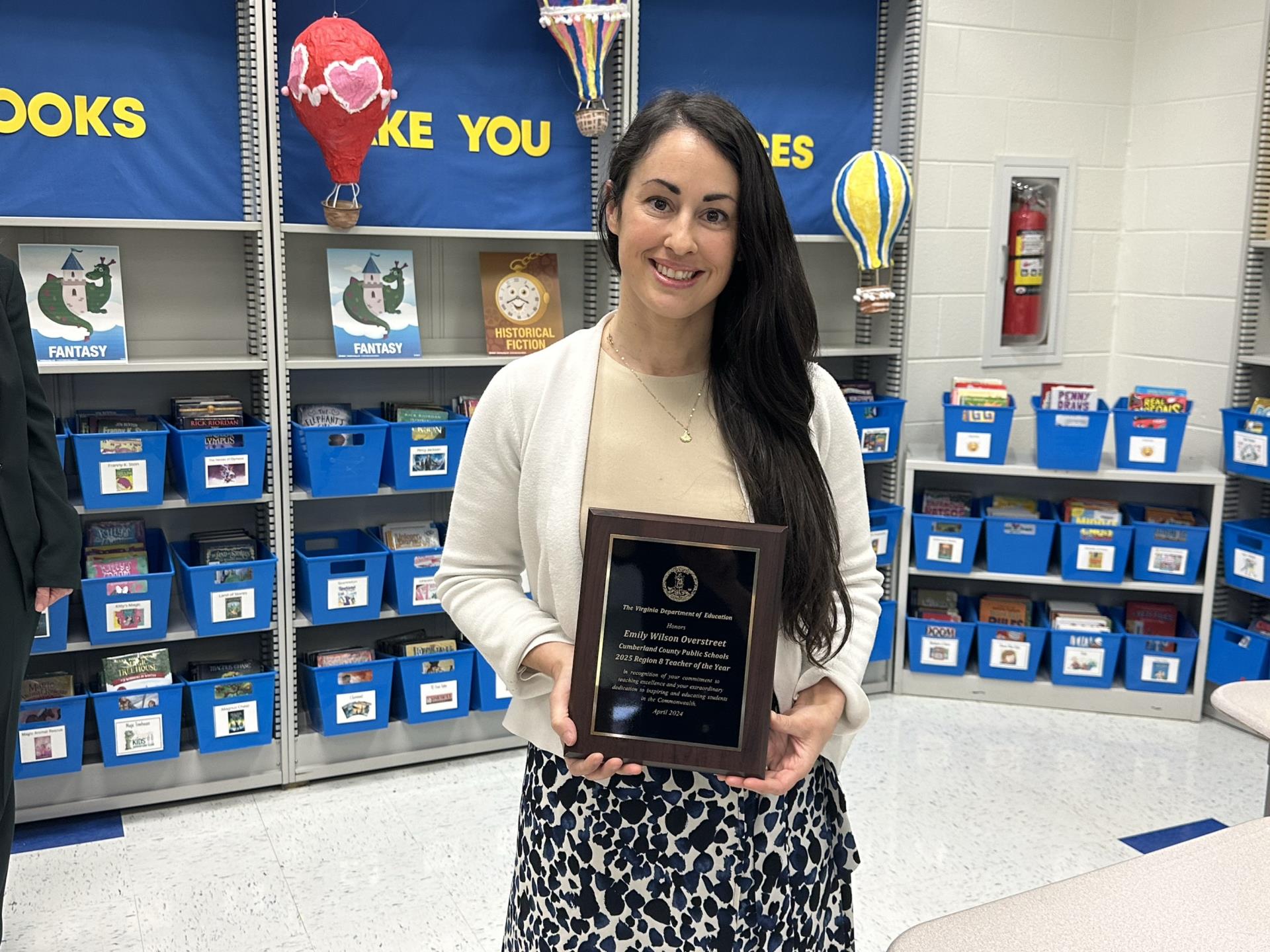 Emily Wilson Overstreet holds Regional Teacher of the Year Plaque