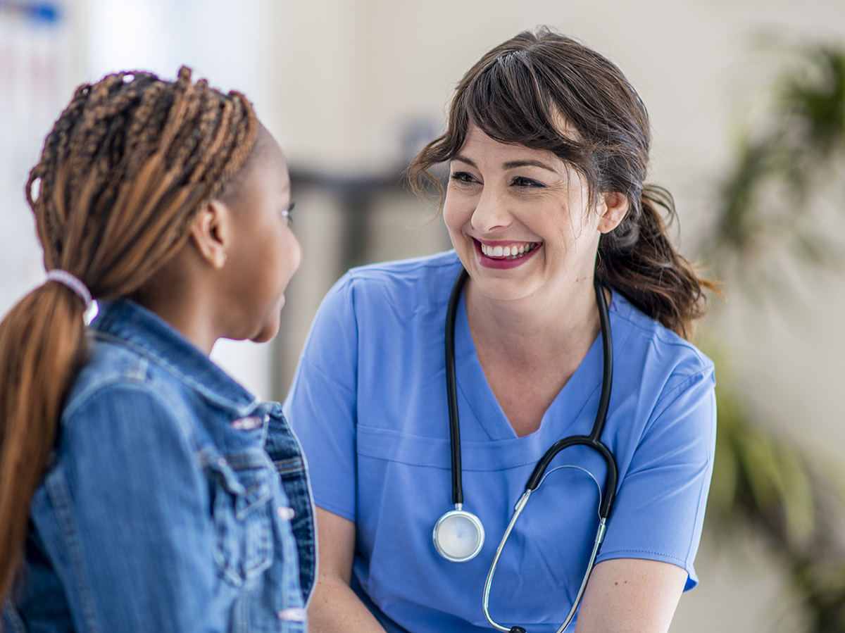 School nurse helping student.