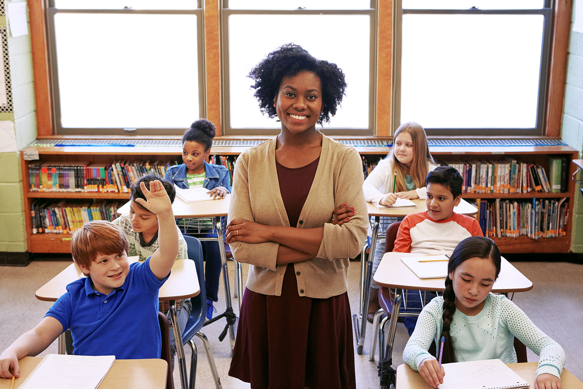 teacher smiling in classroom