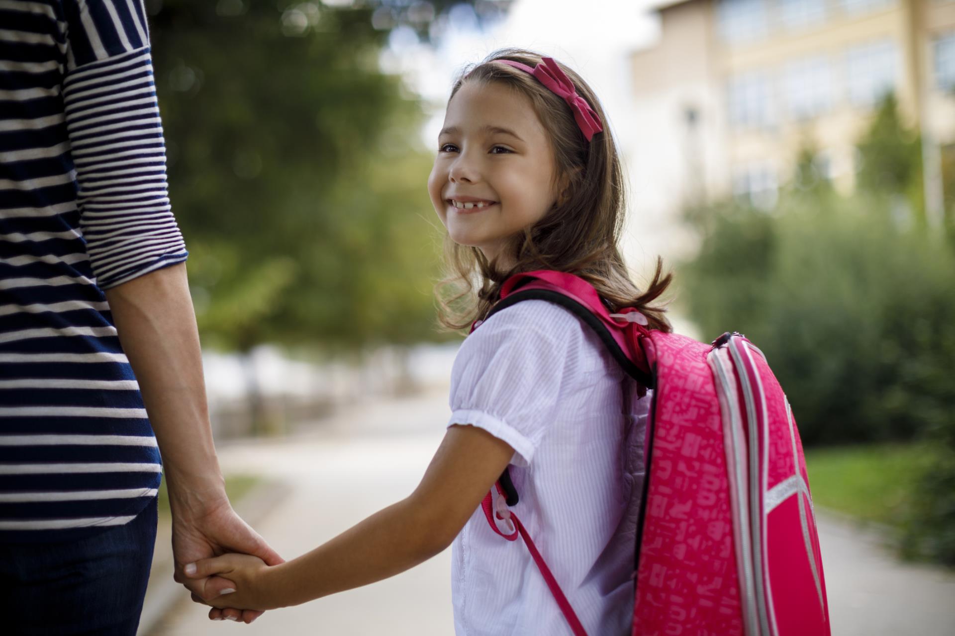 Smiling girl with backpack