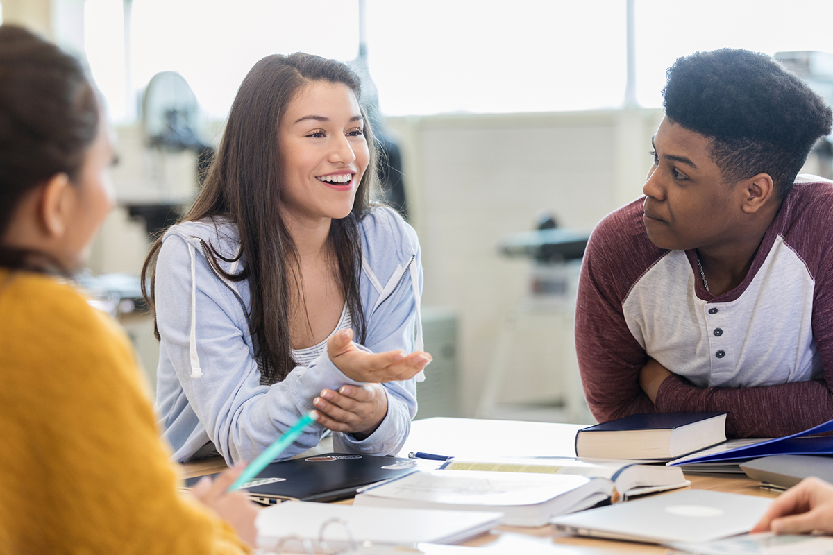 High school students work together at a table.