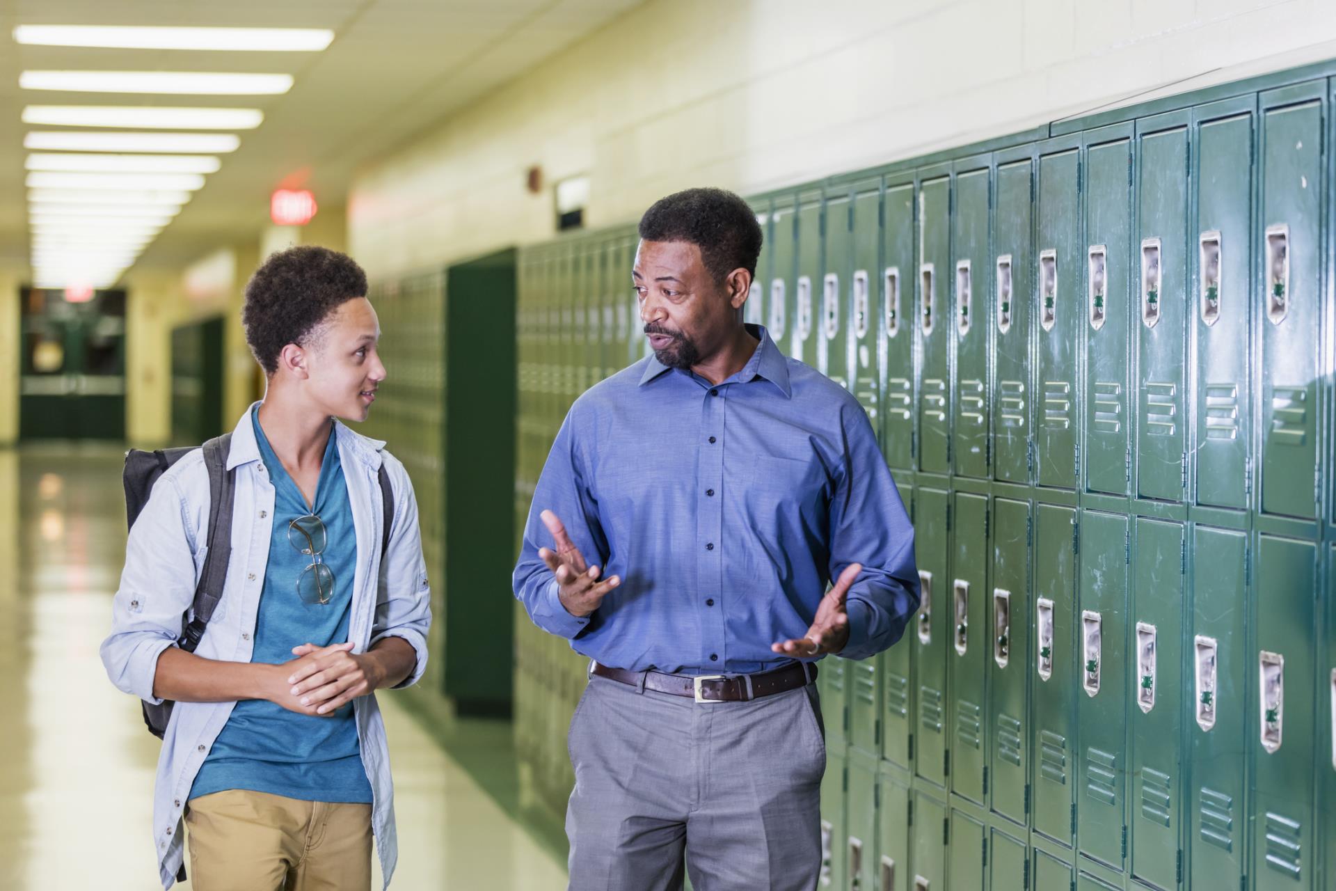 Teacher walking with student