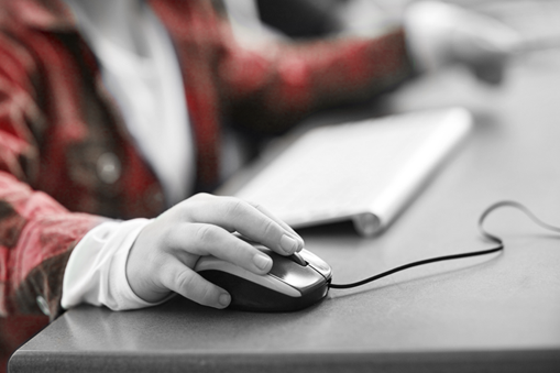 Youth hand using a computer mouse